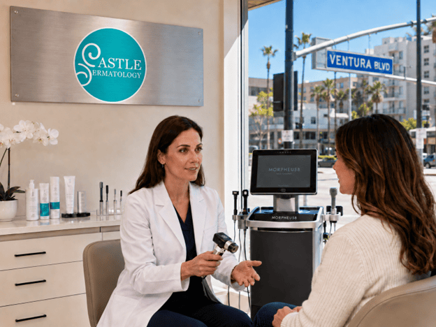 Dermatology Care in Porter Ranch shown through a Castle Dermatology Clinic consultation with a dermatologist holding a dermatoscope, Morpheus8 equipment, branded logo signage, and a Ventura Blvd street view